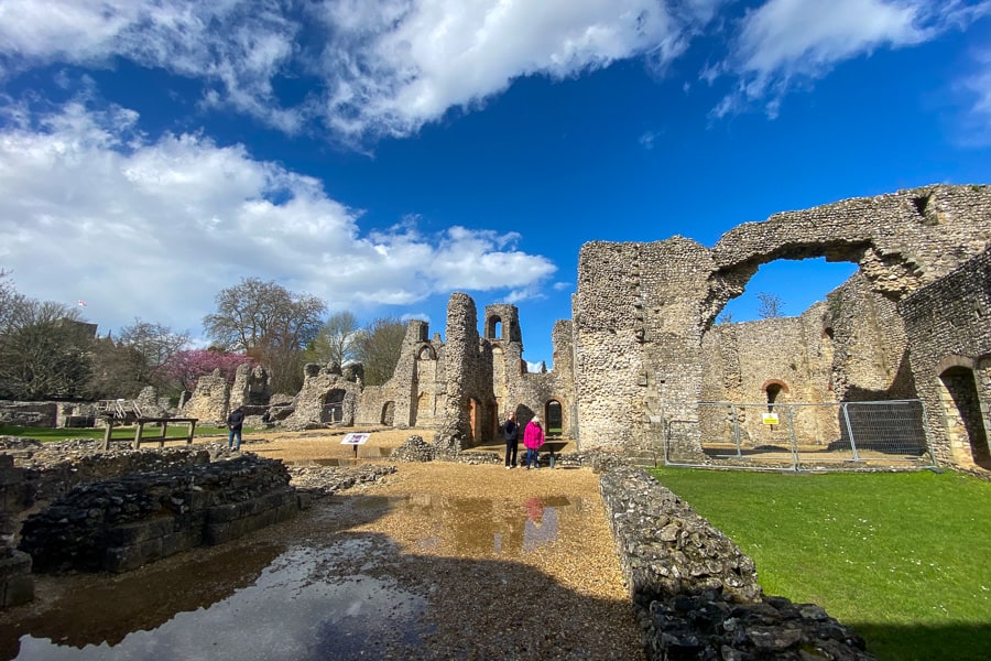 Ruined stone archways and towers at Wolvesey Castle, a must-see on a south England road trip.