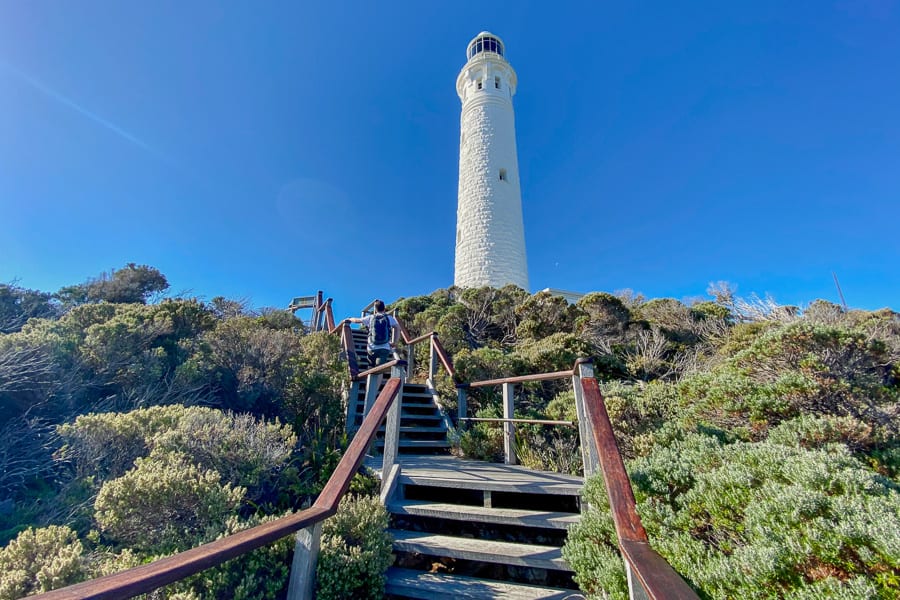 Cape Leeuwin Lighthouse rises tall and white above the coastal heath, marking the most south-westerly point of our Perth road trip.