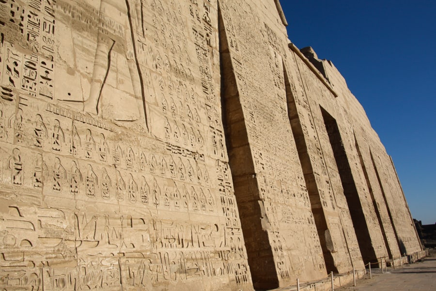A close-up view of the highly decorated entrance pylon of Medinet Habu, one of our surprise Egypt itinerary favourites. 
