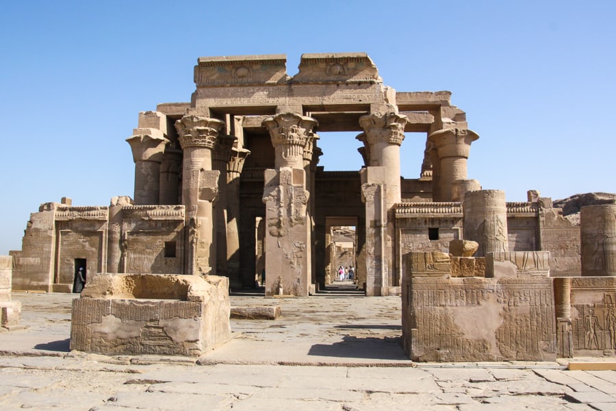 Lotus and papyrus-topped columns rise above the symmetrical twin temple of Kom Ombo, a riverside stop on a Nile cruise itinerary in Egypt. 
