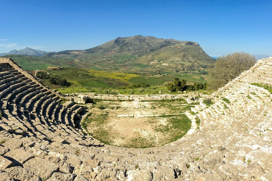 Sicily trip itinerary - View across the curving stone seats of the Greco-Roman Theatre at ancient Segesta. 