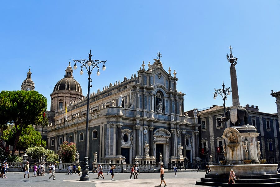 Catania Cathedral looms large and Baroque in grey lava-coloured stone.