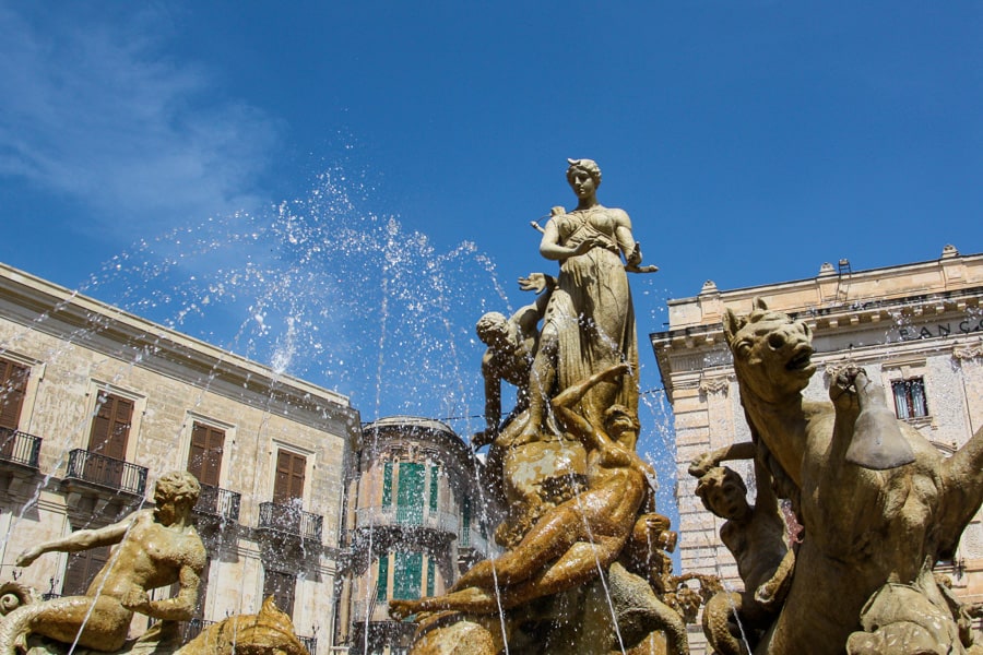Water splashes up on the Fountain of Diana in Ortigia on Day 8 of our itinerary in Sicily.