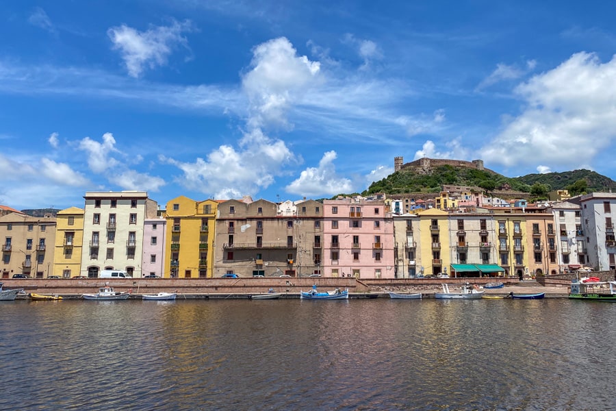 View towards the colourful houses of Bosa from across the Temo River, a must stop town while touring Sardinia.