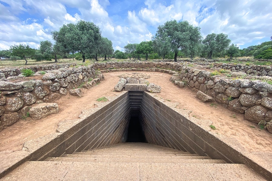 Keyhole shaped Tempio a Pozzo, a fascinating basalt cut well temple – one of the iconic ancient things to see in Sardinia.