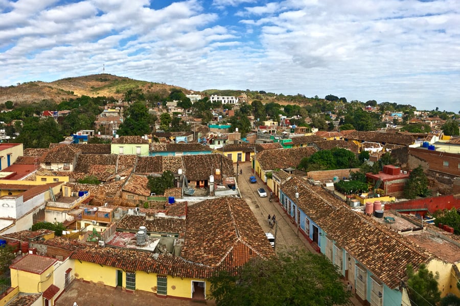 View over the colourful houses of Trinidad from Trinidad's bell tower while backpacking Cuba.