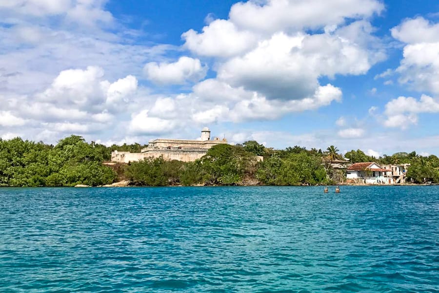 View from the ferry towards the seaside fortress of Castillo de Jaguan on Day 10 of our 2 Weeks in Cuba Itinerary.