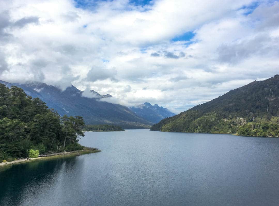 Peaks rise above the waters of Lake Correntoso on the Road of the Seven Lakes.