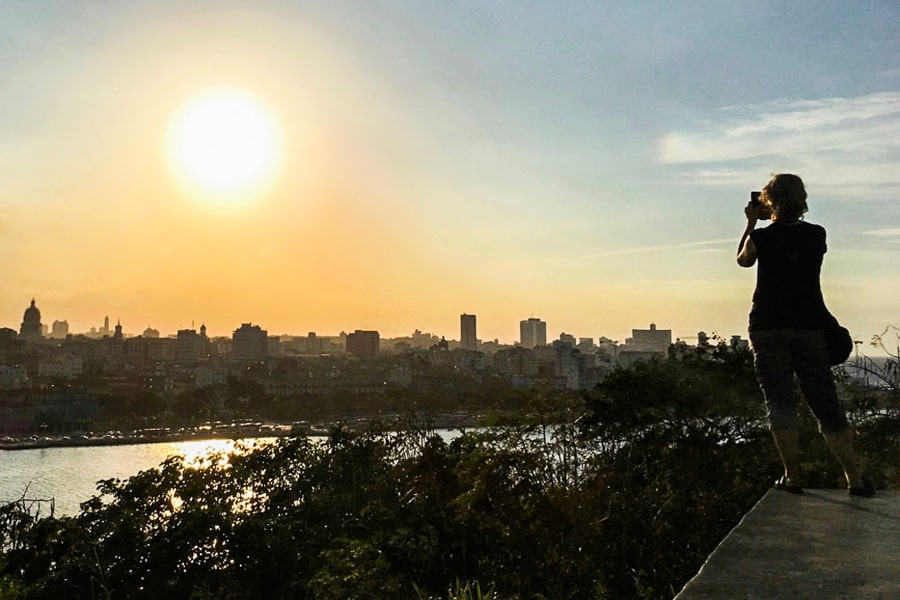 The sun sets over the Havana skyline, the perfect finale to a Cuba 2 week itinerary.