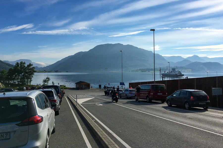 Cars queue at Lauvvik as the Lysefjord ferry approaches the shore of one of the best fjords in Norway to see on a car ferry.