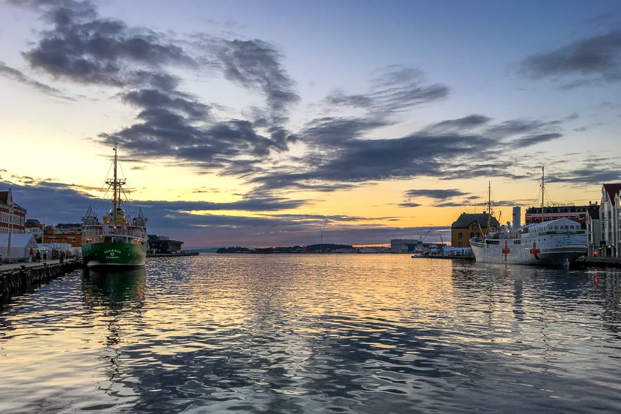 Ships moored in Stavanger harbour at sunset, a must-see on any Norway travel itinerary.