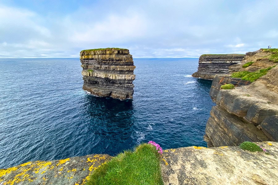 A moody sky presides over Dún Briste sea stack and the cliffs of Downpatrick Head in County Mayo.