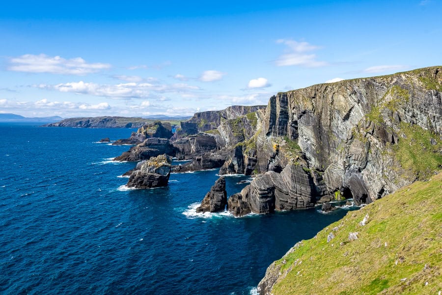 Spectacular view of the cliffs at Mizen Head in sunshine while visiting Ireland.