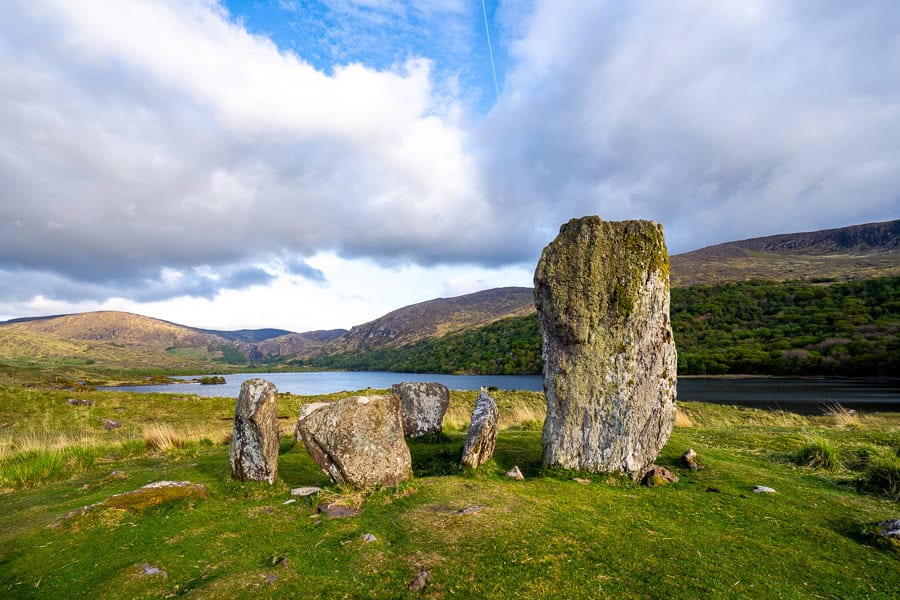 Peaceful Uragh Stone Circle looks out over Lough Inchiquin, an unexpected highlight of our self-drive tour of Ireland.