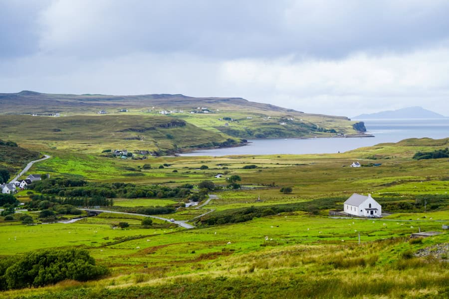 White houses dot green hills on the Isle of Skye.