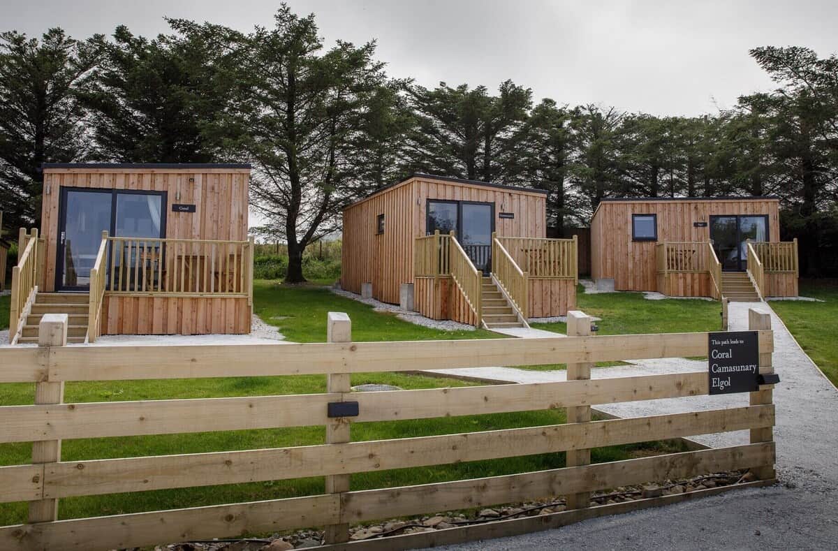 A row of wooden cabins, one of many places to stay on Skye.