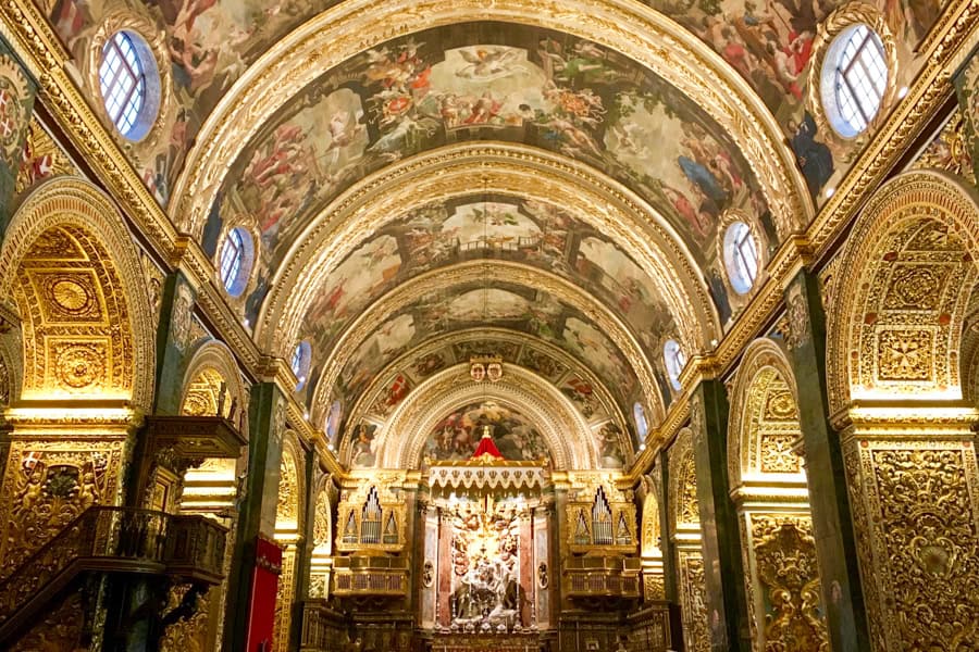 The barrel-roofed interior of St Paul’s with fresco covered ceilings and gold-leaf archways, a Malta must visit.