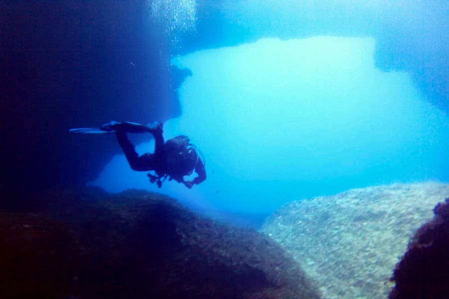 A scuba diver underwater at Gozo’s Blue Hole.