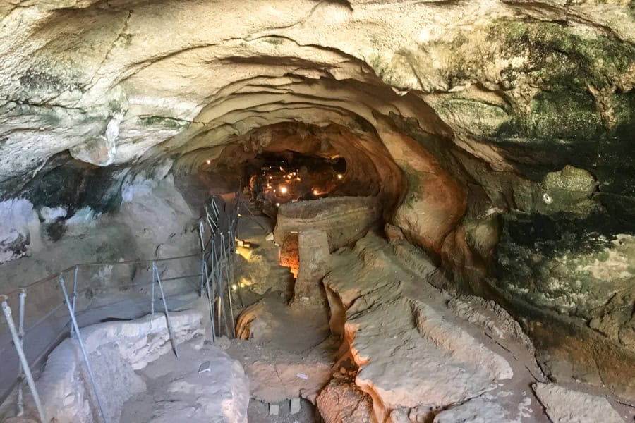 Looking into a long narrow tunnel at Ghar Dalam Cave, one of our 25 best things to do in Malta.