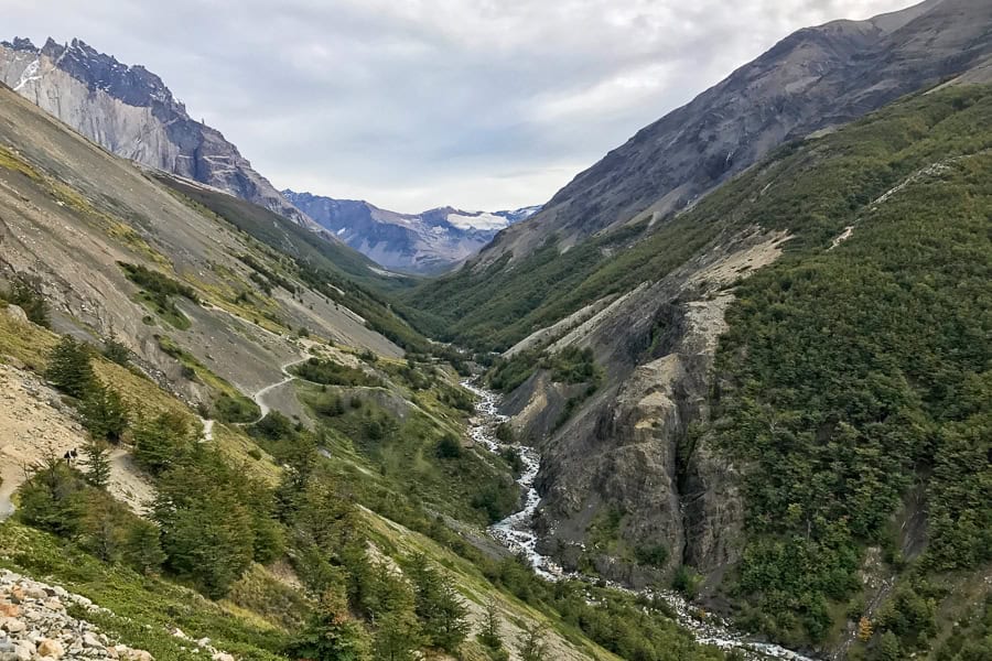 Views above a valley with a river running through it and the W trail winding away in the distance.