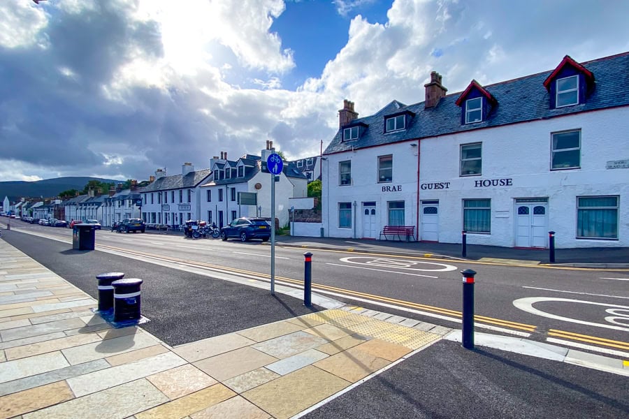Whitewashed houses and inns line the waterfront in pretty Ullapool, a convenient overnight for the North Coast 500 route.