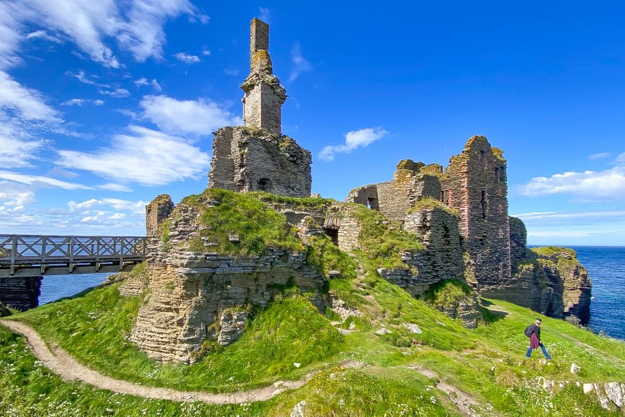 The imposing ruins of Castle Sinclair Girnigoe perch on a sea stack – a site worth visiting on your NC500 itinerary.