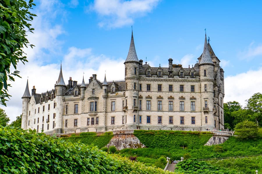 View of the many spires of Dunrobin Castle from the Moray Firth, one of the first stops on our North Coast 500 itinerary.