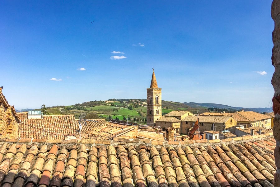 Views across the rooftops of Urbino towards the countryside during our Italy itinerary.
