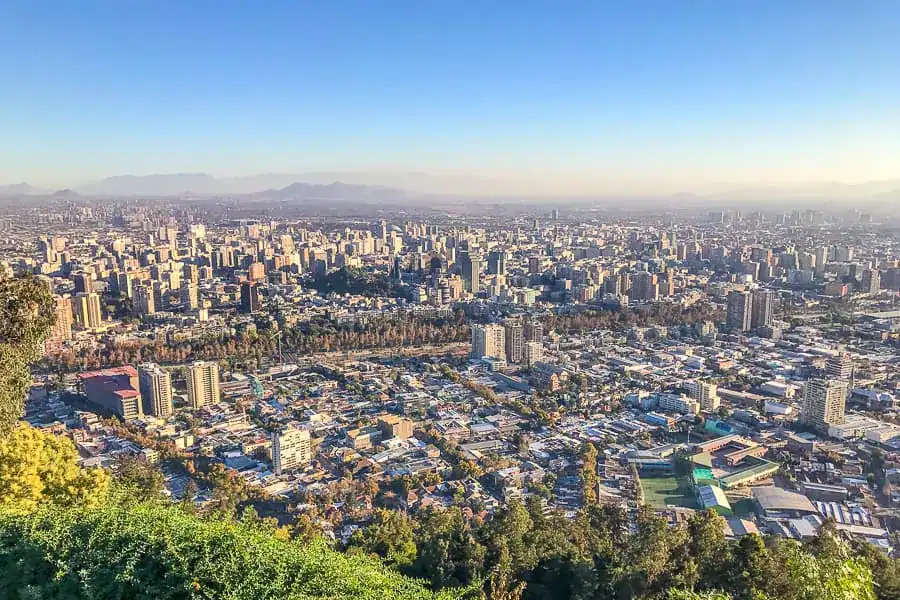 Views across the Santiago skyline and beyond where wine tasting awaits – one of our favourite things to do in Santiago.