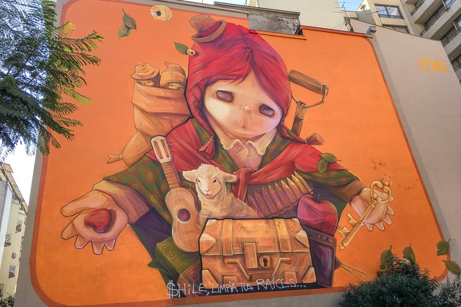 A large, colourful mural adorns the side of a building – seeing street art is one of the best free things to do in Santiago.