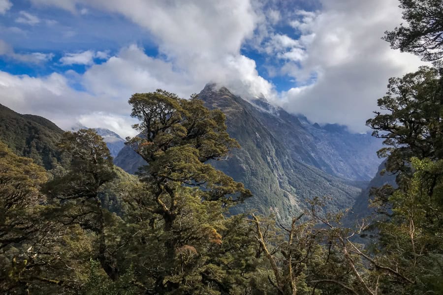 Routeburn weather moves in with rain clouds gathering over mountain peaks in Fiordland National Park.