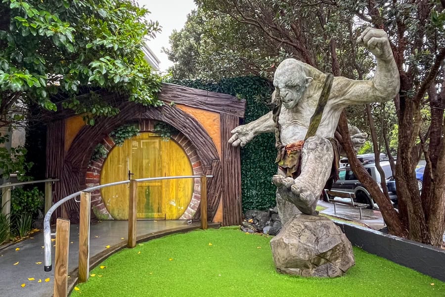 A troll statue guards the hobbit style entry of Wētā Workshop – one of the top places to go in Wellington for movie buffs.