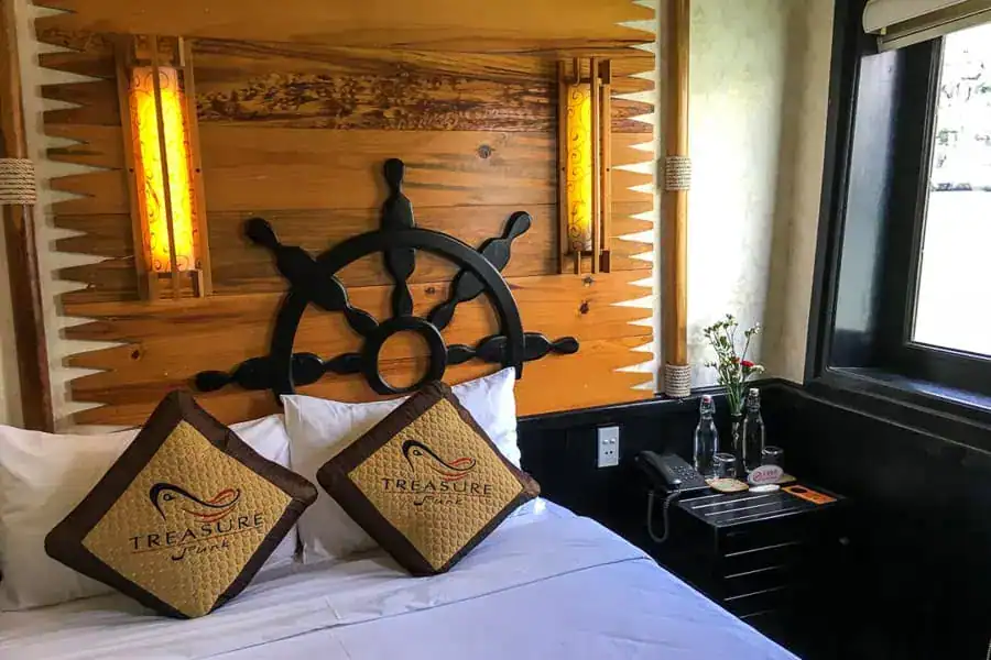View of a cute double cabin with steering wheel design on the bed aboard our Bai Tu Long cruise on Treasure Junk.