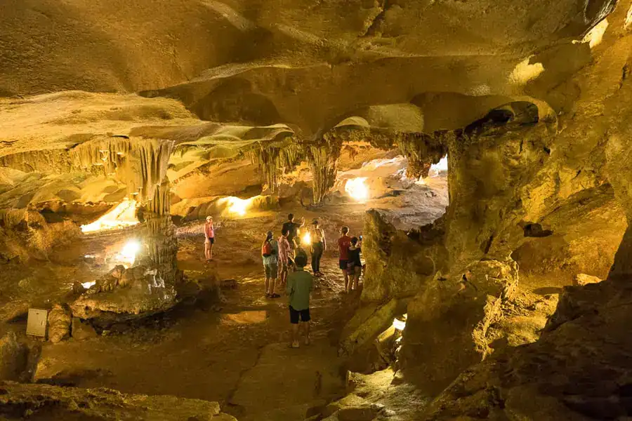 Beautifully illuminated stalagmites and stalactites in Co Cave on our Bai Tu Long Bay cruise.
