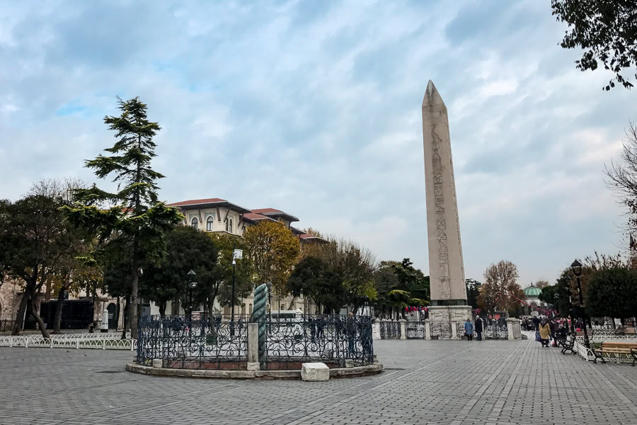 A tall obelisk in the cobbled square of the Hippodrome on an Istanbul itinerary.