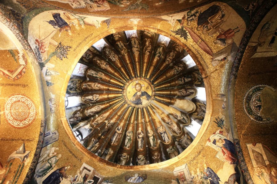Detailed mosaic pictures decorate a dome and archways at Chora.