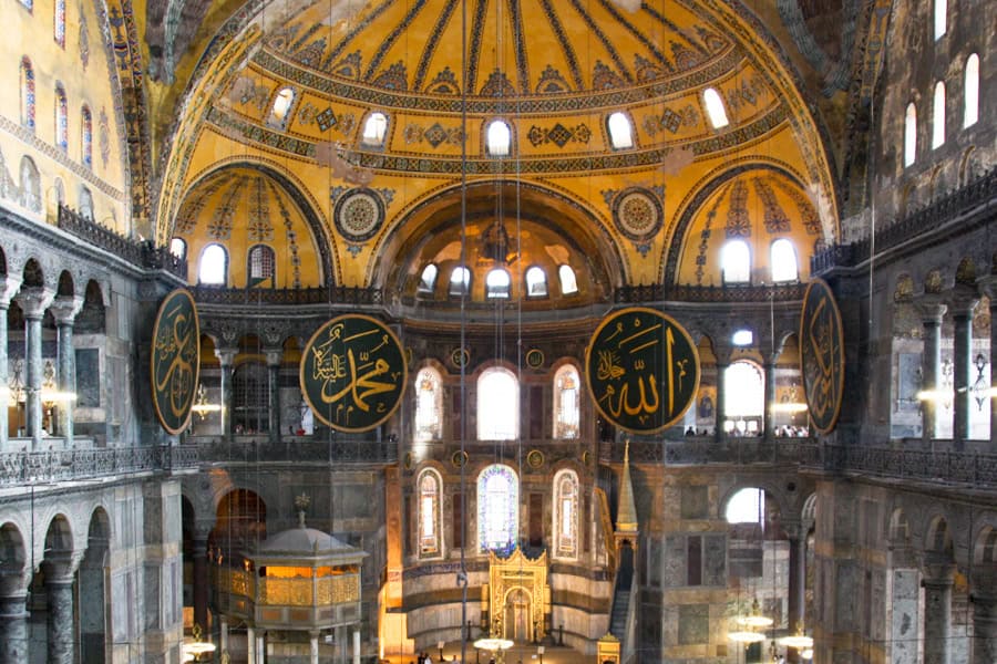 Arches and domes with mosaics and medallions at Hagia Sophia on an Istanbul trip.