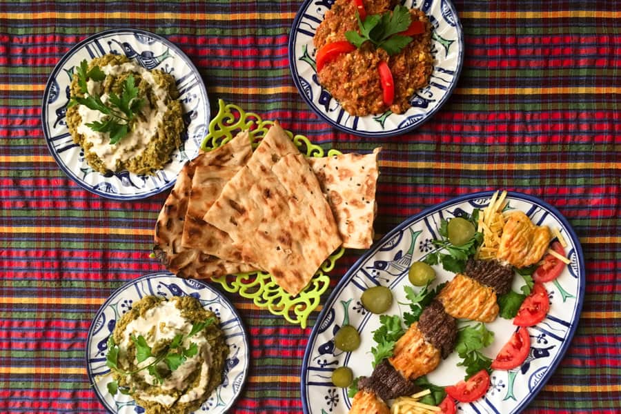 Fresh local dishes of breads, dips and meats on a table – one of the simple joys when you travel together.
