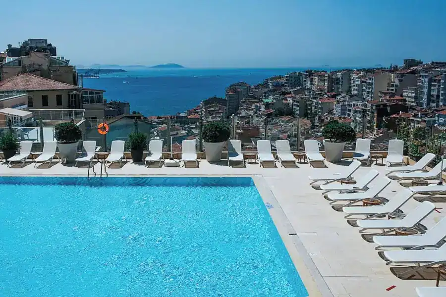 Rooftop pool with sunbeds and views at Marmara Taksim – a good pick if you want somewhere to stay in Istanbul with a pool.