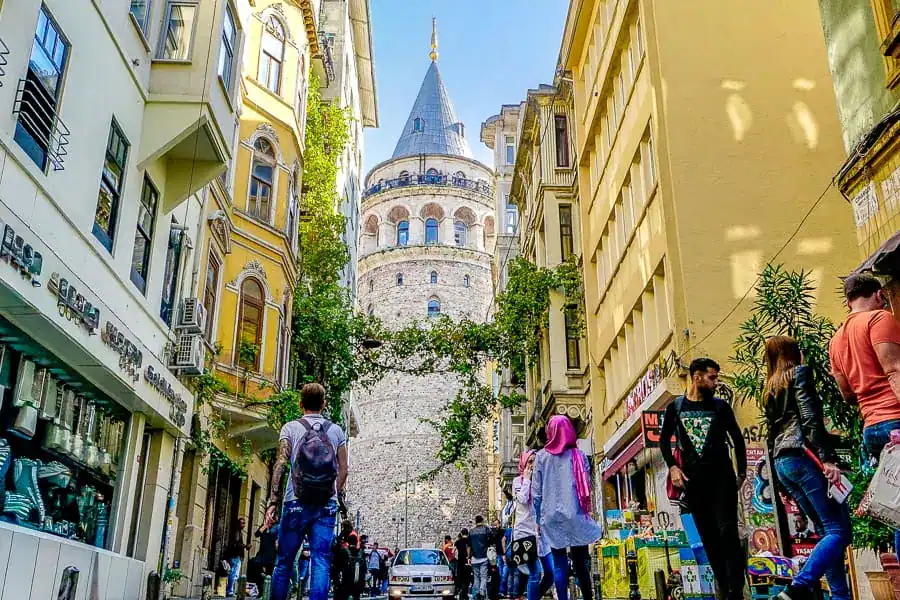 View down a narrow, busy street towards Galata Tower – a great area to stay if you have 1 week in Istanbul (or longer).