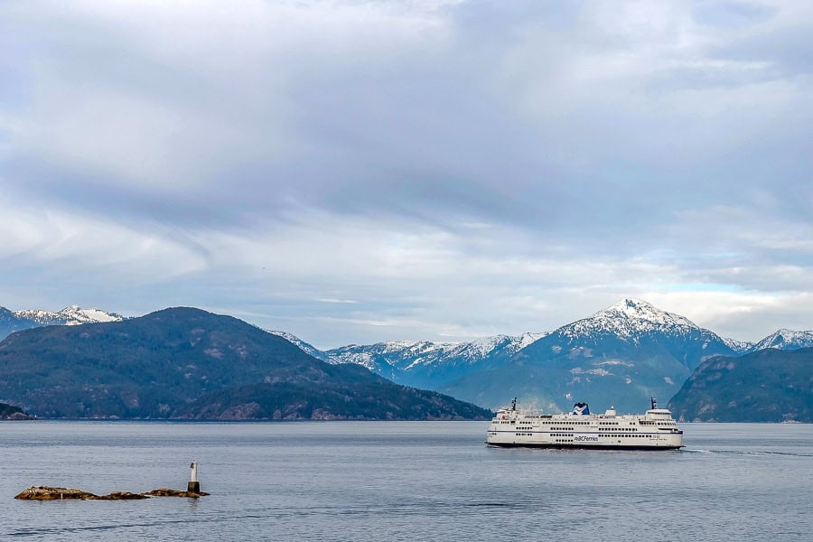 A ferry crosses Horseshoe Bay with snowcapped peaks in the distance – a picturesque end to our Vancouver Island itinerary.