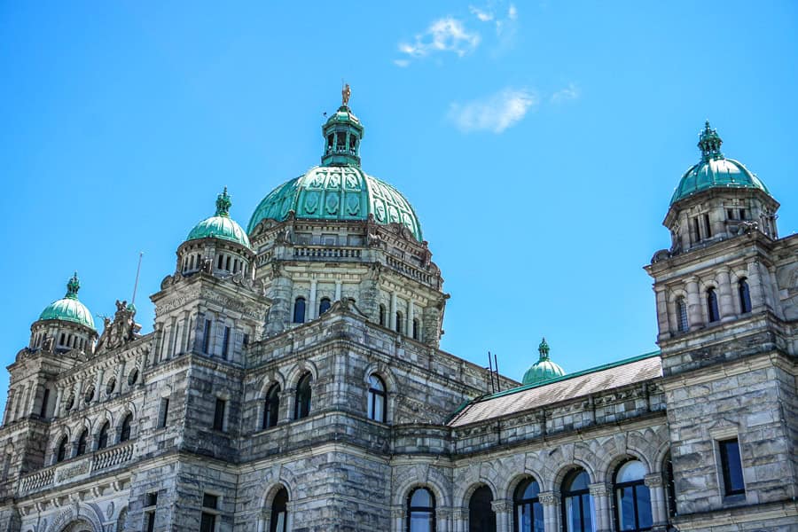 The imposing domed façade of the Legislative Assembly of British Colombia sparkles in the summer sun.