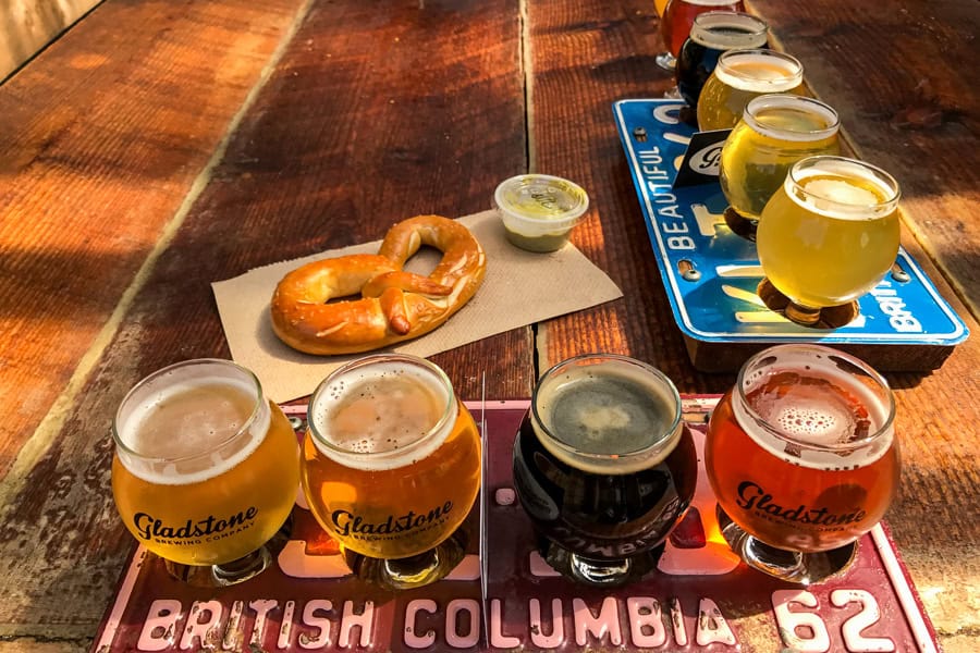 Paddles of beer served on old number plates in Gladstone – we always find time for beer on our Vancouver Island itinerary.