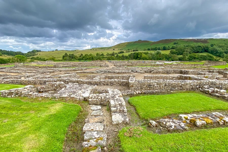 Views across the extensive fort ruins at Vindolanda on Hadrian’s Wall, one of our favourite things to see in Northumberland.