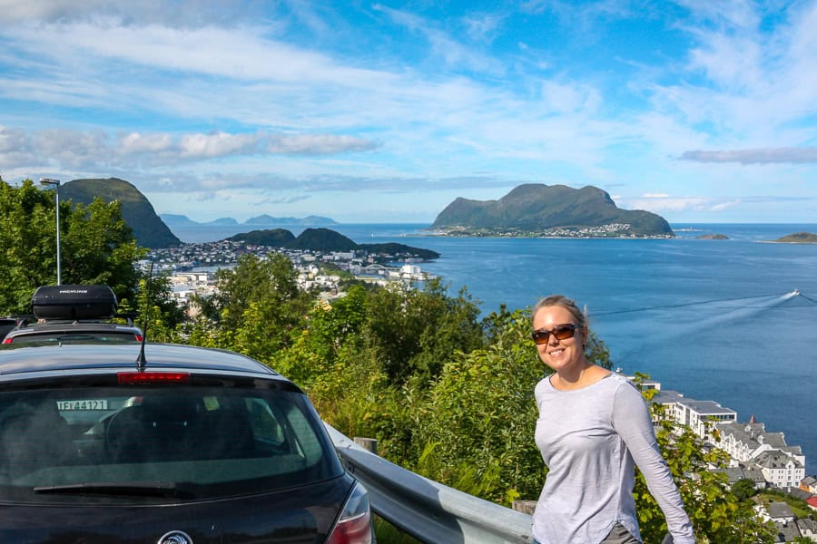 A woman enjoys views over Alesund on a beautifully sunny day.